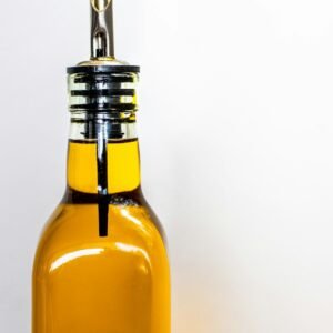 Cold-pressed black seed oil in a glass bottle